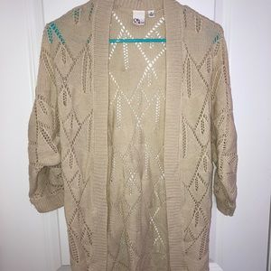 Cream cardigan, sleeves are elbow length-ish